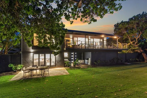 a view of a house with a yard porch and sitting area