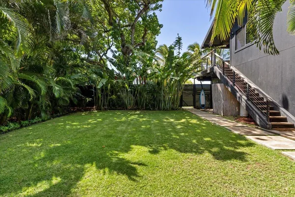 a backyard of a house with lots of green space