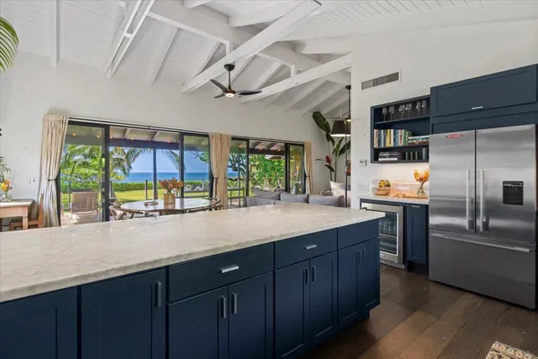 a kitchen with stainless steel appliances a sink and a refrigerator