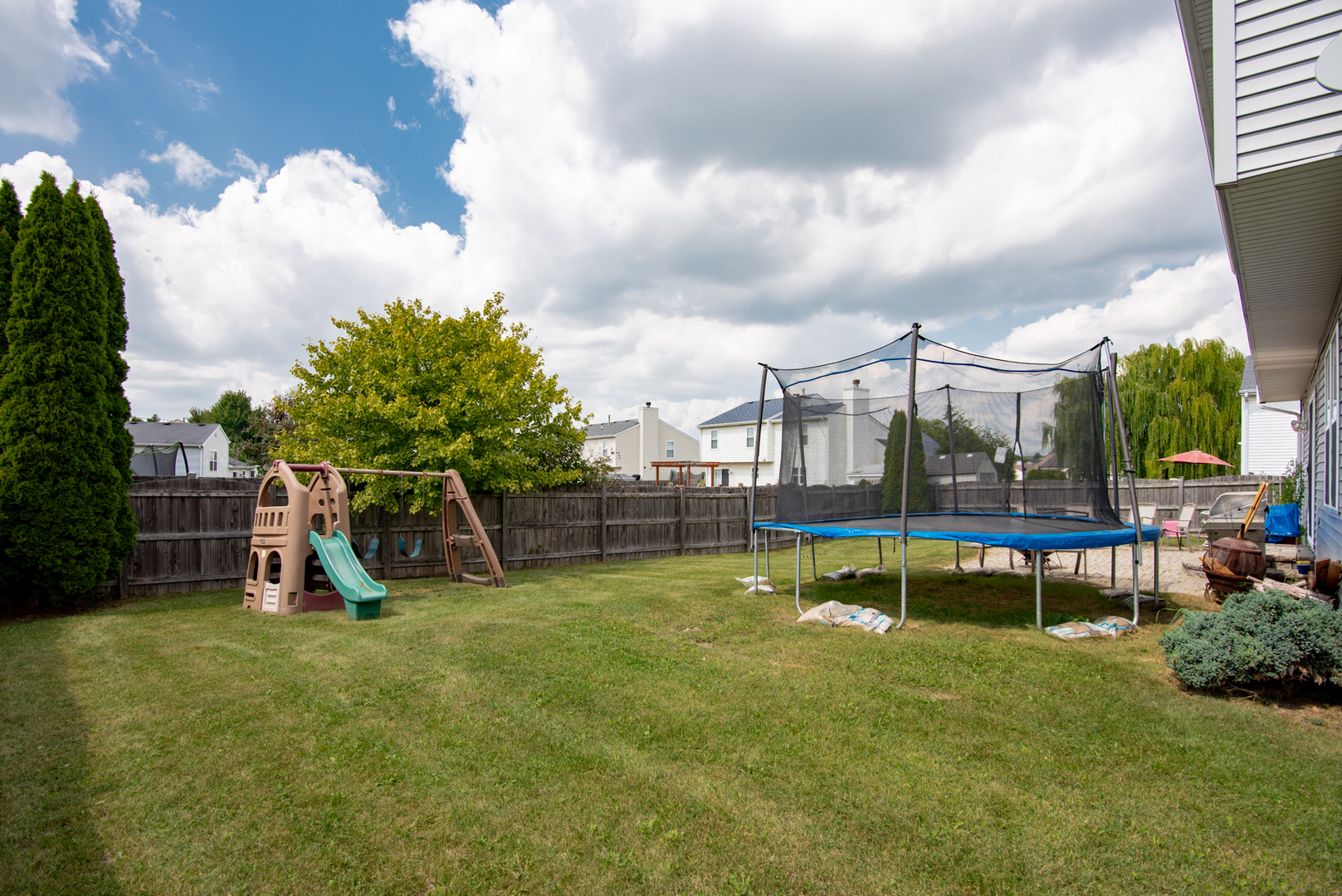 1010 Pheasant Run Zion, IL 60099 - Photo 4 of 4 a view of a park with swings and slides