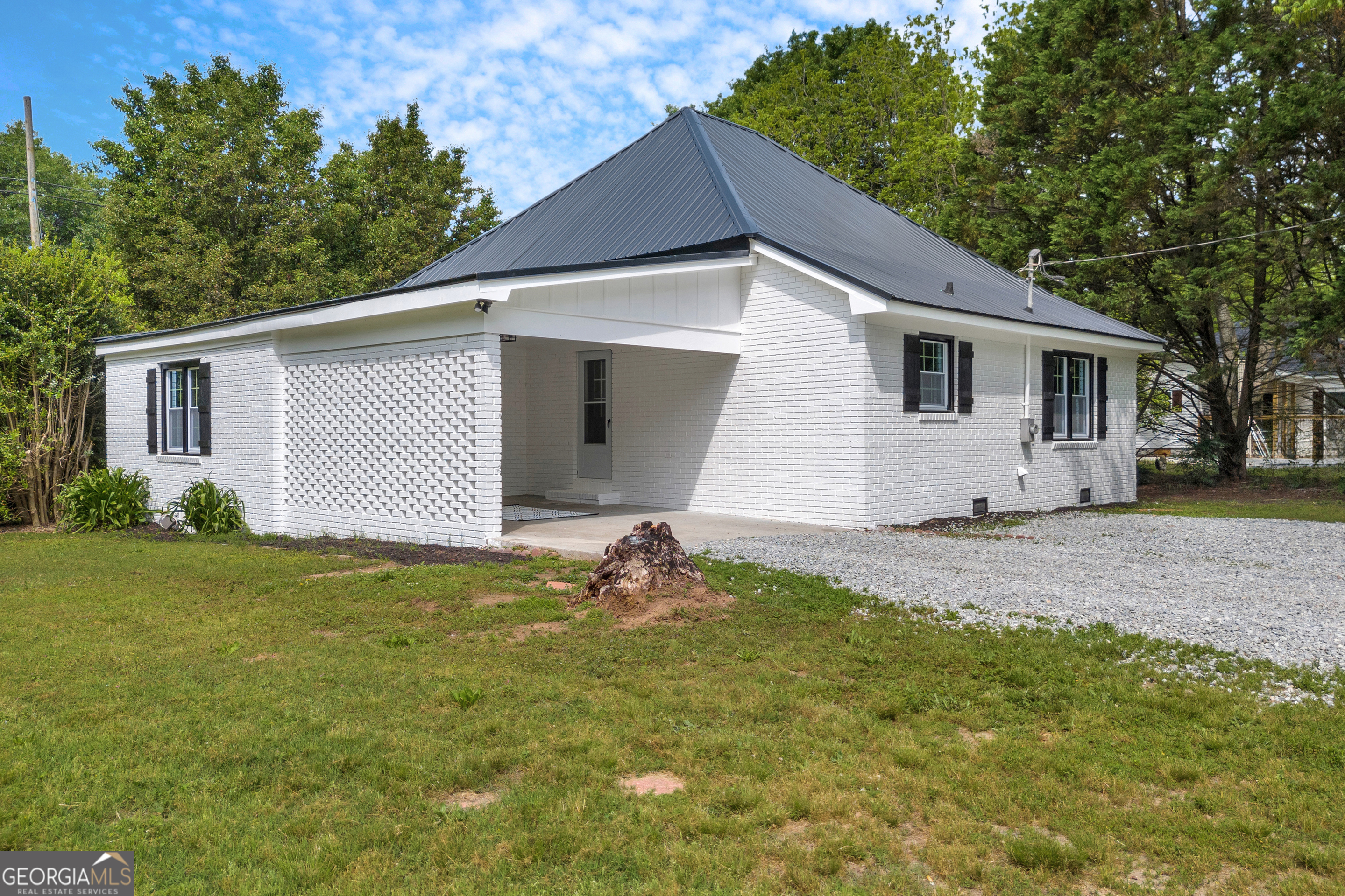 3611 Old Elbert Road Royston, GA 30662 - Photo 1 of 1 a backyard of a house with table and chairs