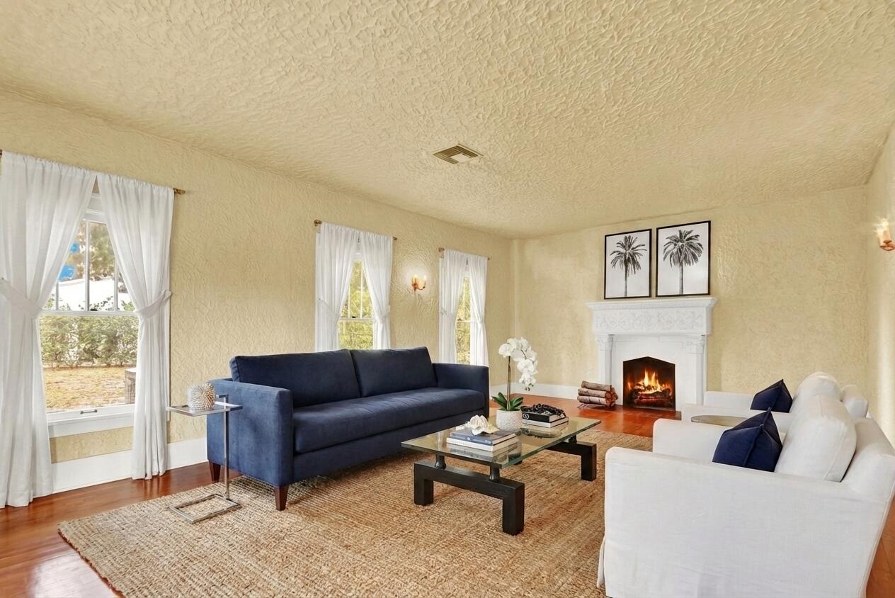 322 Westminster Road West Palm Beach, FL 33405 - Photo 11 of 68 a living room with furniture fireplace and a window