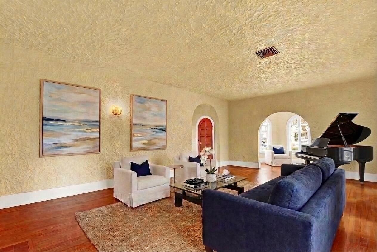 322 Westminster Road West Palm Beach, FL 33405 - Photo 13 of 68 a living room with fireplace furniture and a large window
