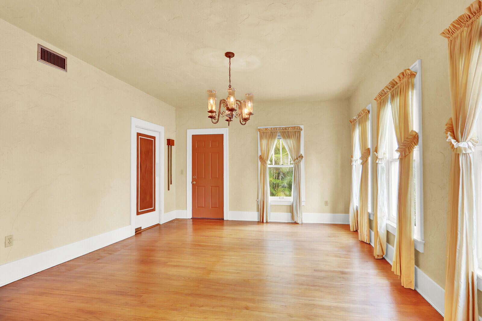 322 Westminster Road West Palm Beach, FL 33405 - Photo 18 of 68 a view of an empty room with a window and wooden floor