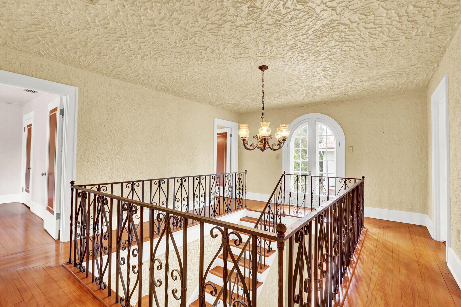 322 Westminster Road West Palm Beach, FL 33405 - Photo 31 of 68 a view of staircase with railing and wooden floor