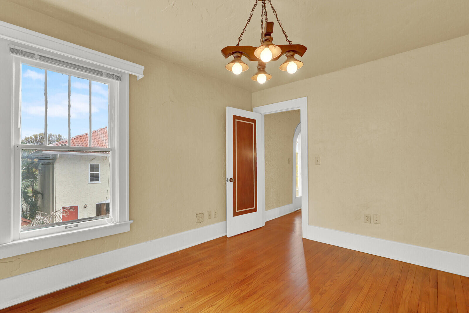 322 Westminster Road West Palm Beach, FL 33405 - Photo 36 of 68 a view of an empty room with wooden floor and a window