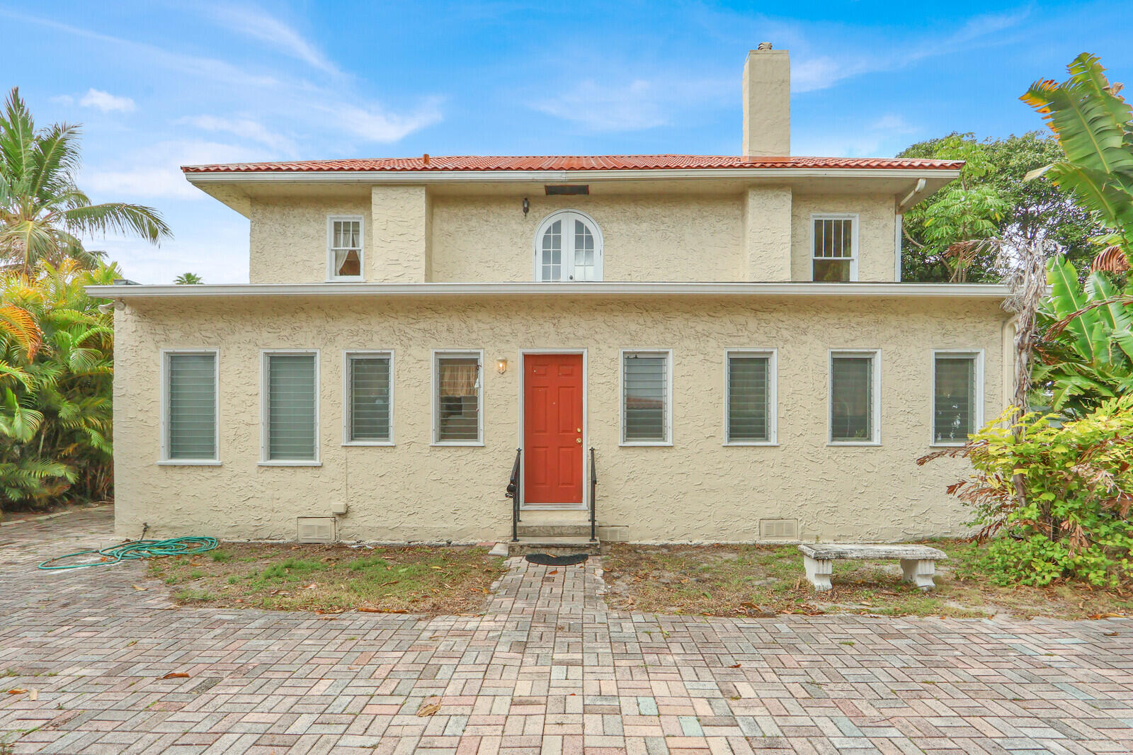 322 Westminster Road West Palm Beach, FL 33405 - Photo 45 of 68 a front view of a house with a yard