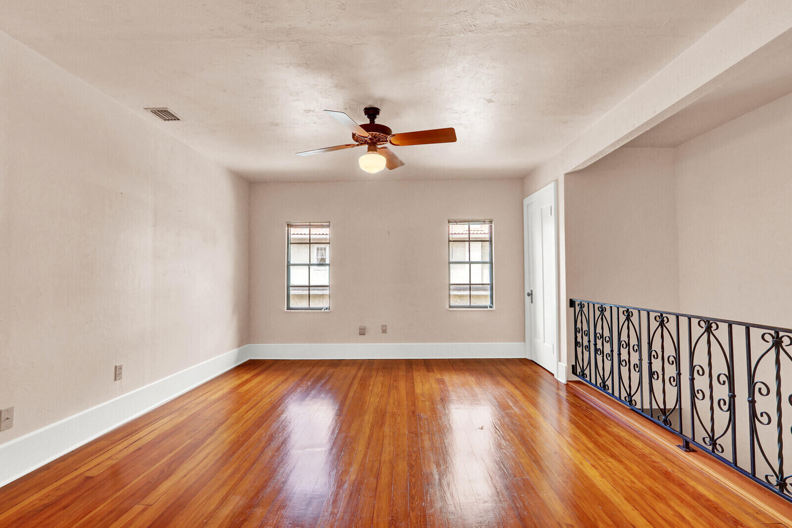 322 Westminster Road West Palm Beach, FL 33405 - Photo 49 of 68 wooden floor in an empty room with a window