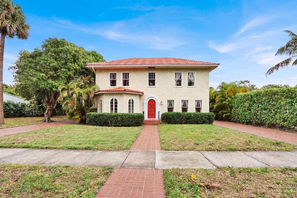 322 Westminster Road West Palm Beach, FL 33405 - Photo 5 of 68 a front view of a house with a yard
