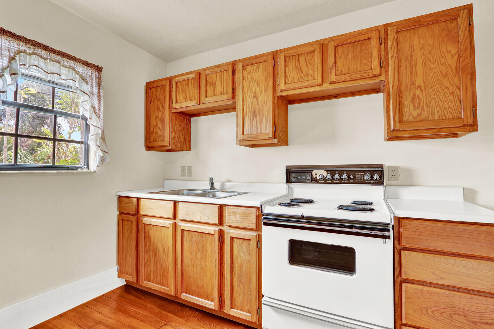 322 Westminster Road West Palm Beach, FL 33405 - Photo 51 of 68 a kitchen with stainless steel appliances granite countertop a stove and a microwave