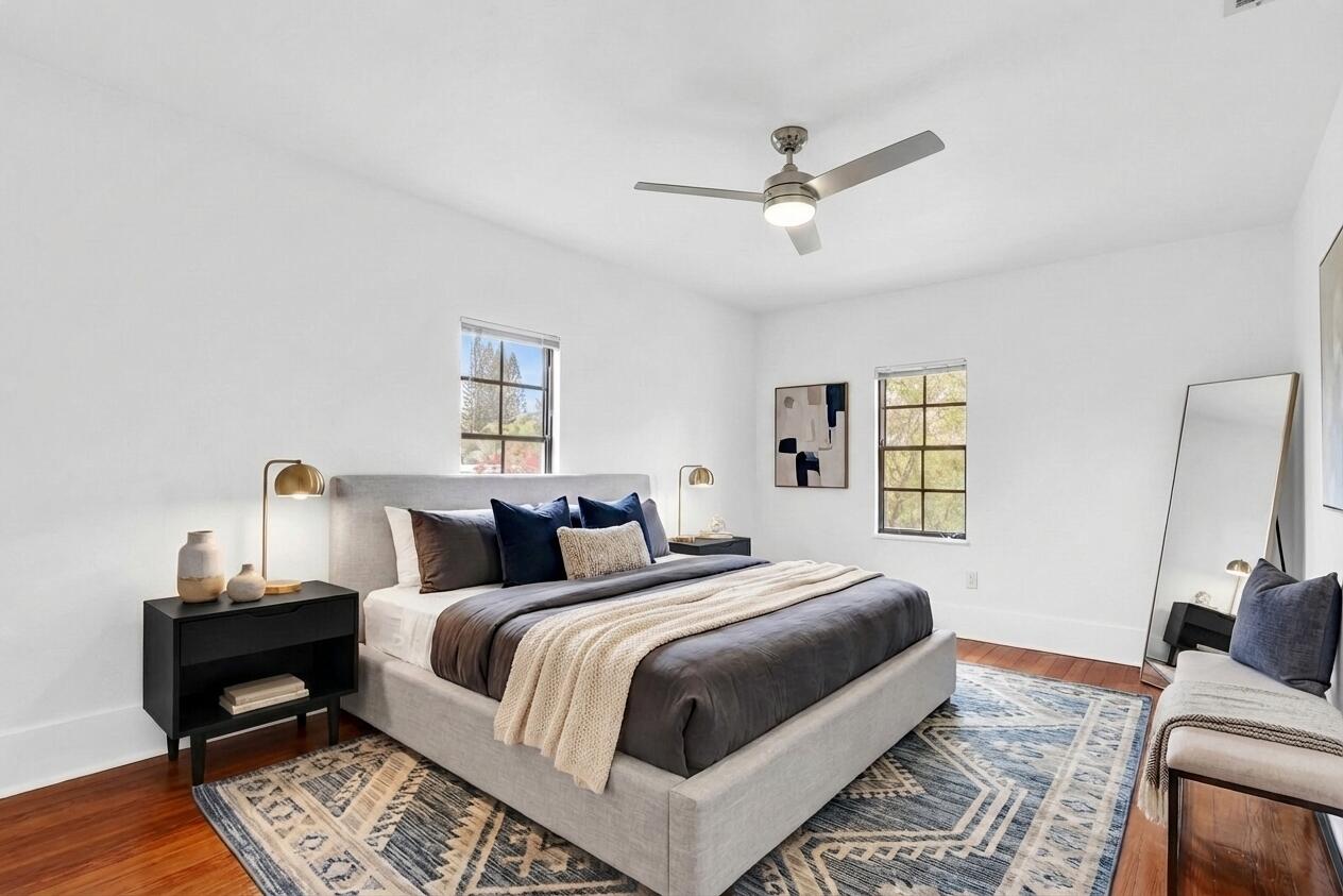 322 Westminster Road West Palm Beach, FL 33405 - Photo 56 of 68 a bedroom with a bed and wooden floor
