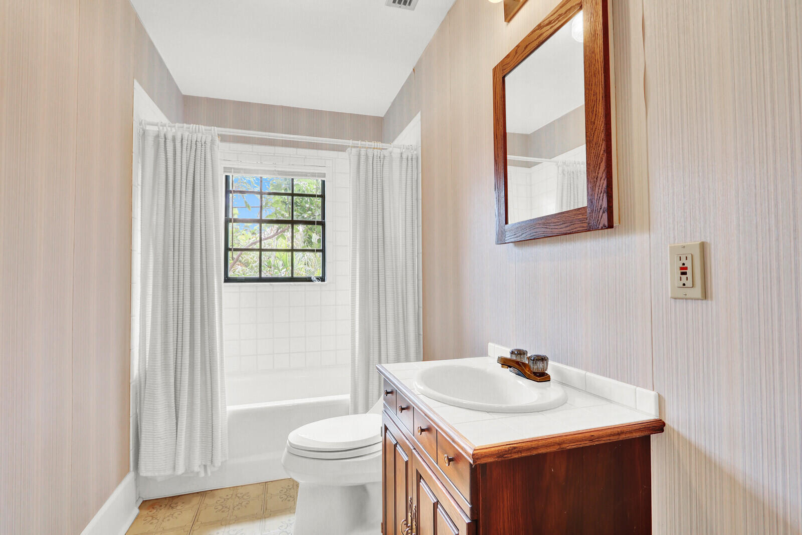 322 Westminster Road West Palm Beach, FL 33405 - Photo 57 of 68 a bathroom with a sink toilet and window