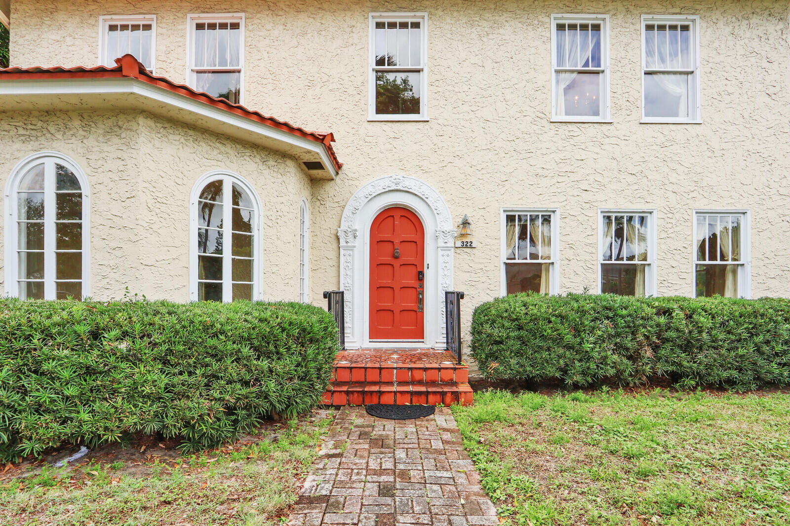 322 Westminster Road West Palm Beach, FL 33405 - Photo 6 of 68 a front view of a house with a yard