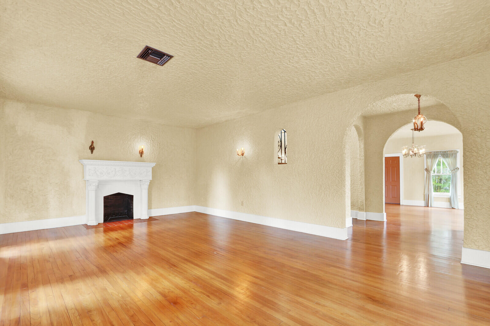 322 Westminster Road West Palm Beach, FL 33405 - Photo 10 of 68 a view of a livingroom with wooden floor a fireplace and windows