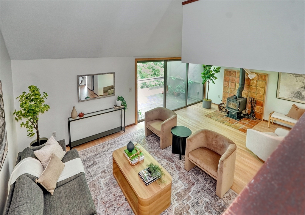 422 Great Elm Way, Unit 422 Acton, MA 01718 - Photo 12 of 30 a living room with furniture and a large window
