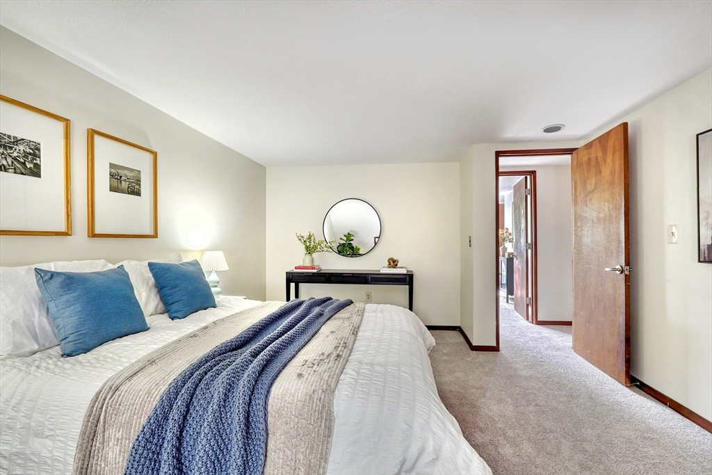 422 Great Elm Way, Unit 422 Acton, MA 01718 - Photo 18 of 30 a bedroom with a bed and a window