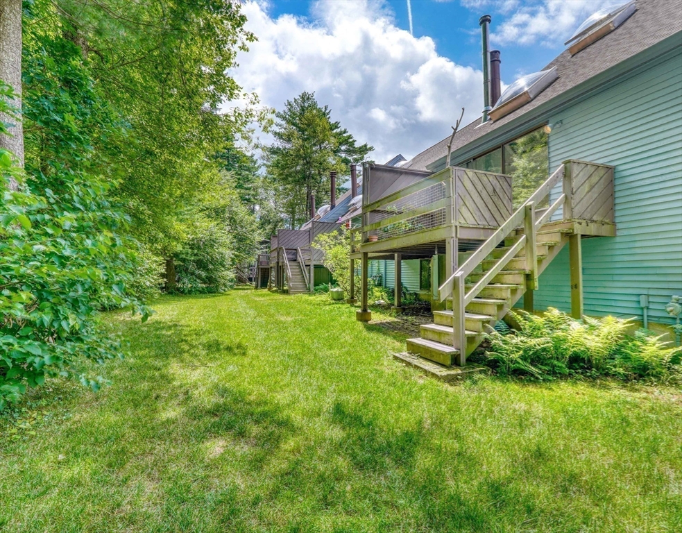 422 Great Elm Way, Unit 422 Acton, MA 01718 - Photo 21 of 30 a view of a house with a park