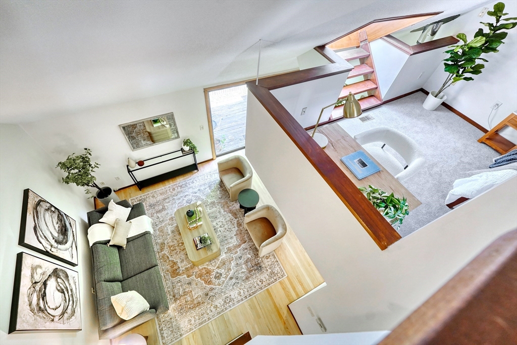 422 Great Elm Way, Unit 422 Acton, MA 01718 - Photo 6 of 30 view of a living room and wooden floor