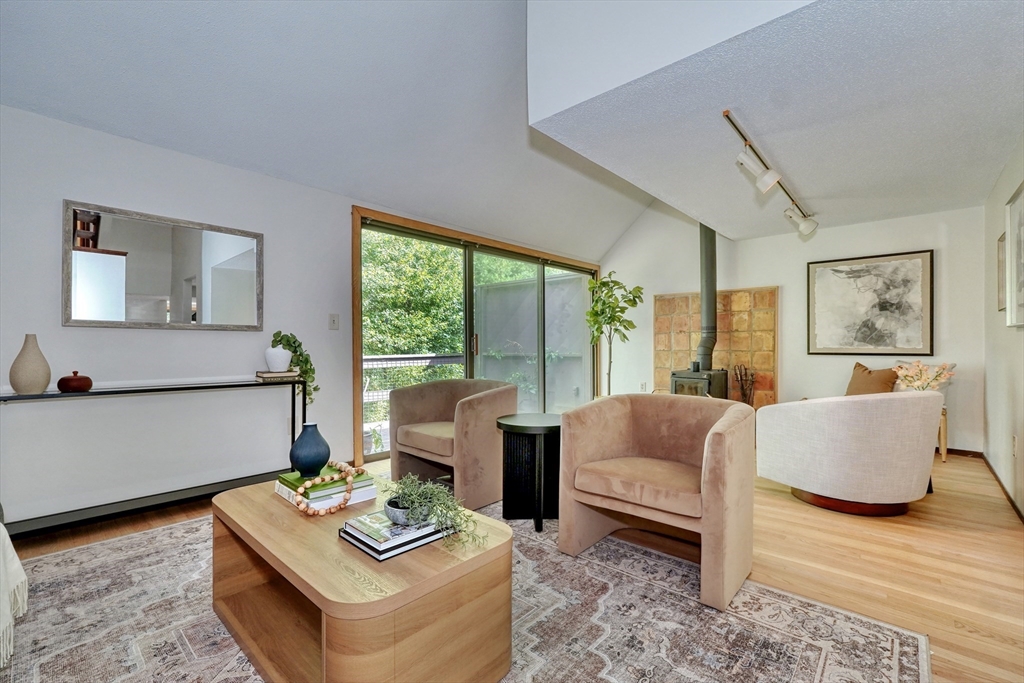 422 Great Elm Way, Unit 422 Acton, MA 01718 - Photo 8 of 30 a living room with furniture and a window