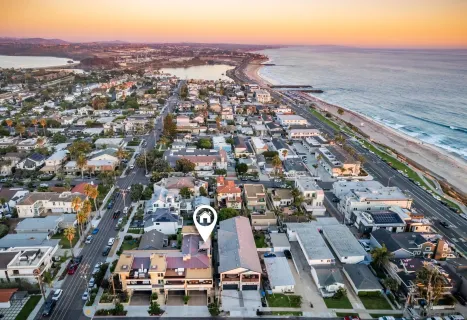 an aerial view of residential houses with outdoor space