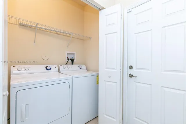 a bathroom with a bathtub shower sink and mirror