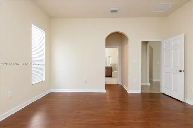 a kitchen with stainless steel appliances granite countertop a stove and a sink