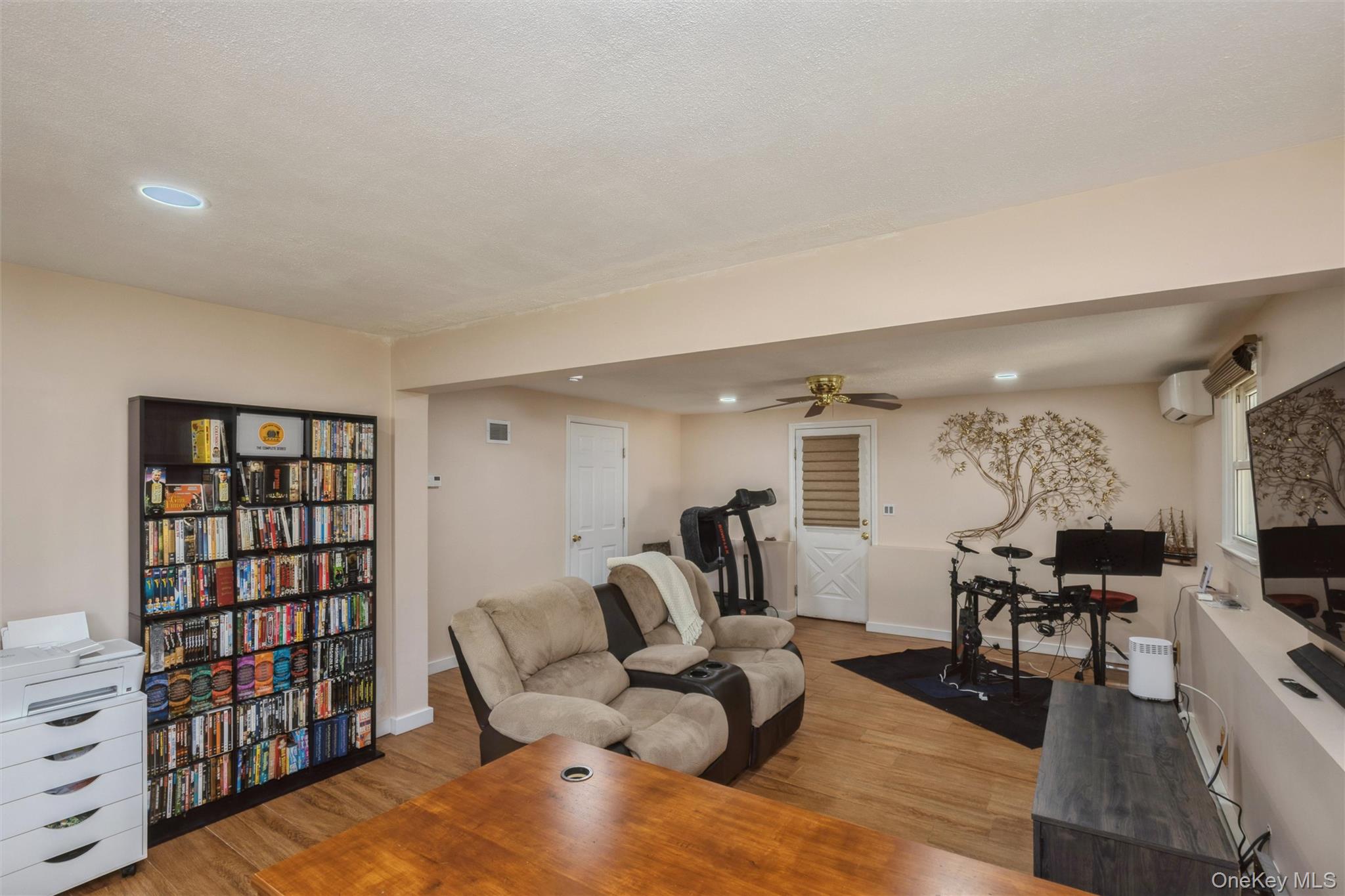 115 Clarendon Road Ronkonkoma, NY 11779 - Photo 21 of 45 Open concept room with recessed lighting and laminated flooring