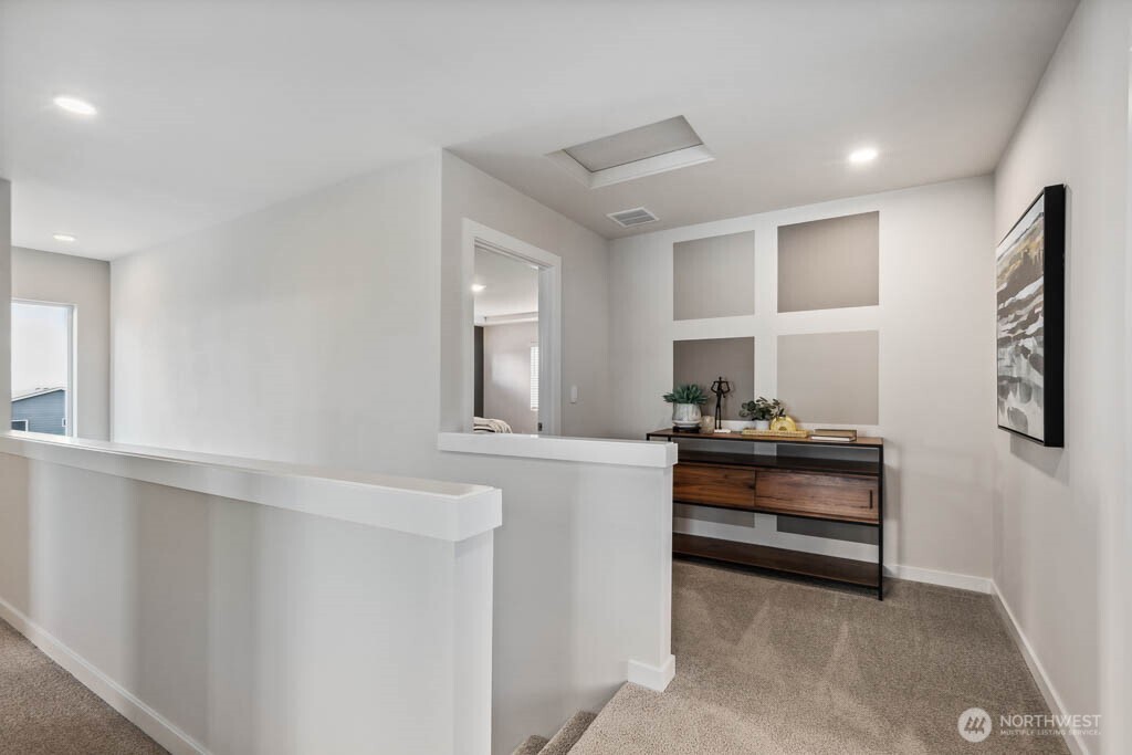 3807 194th Place Southeast Bothell, WA 98012 - Photo 13 of 21 a living room with stainless steel appliances furniture a rug and a window