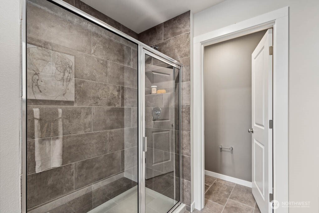 3807 194th Place Southeast Bothell, WA 98012 - Photo 18 of 21 a bathroom with a glass shower door