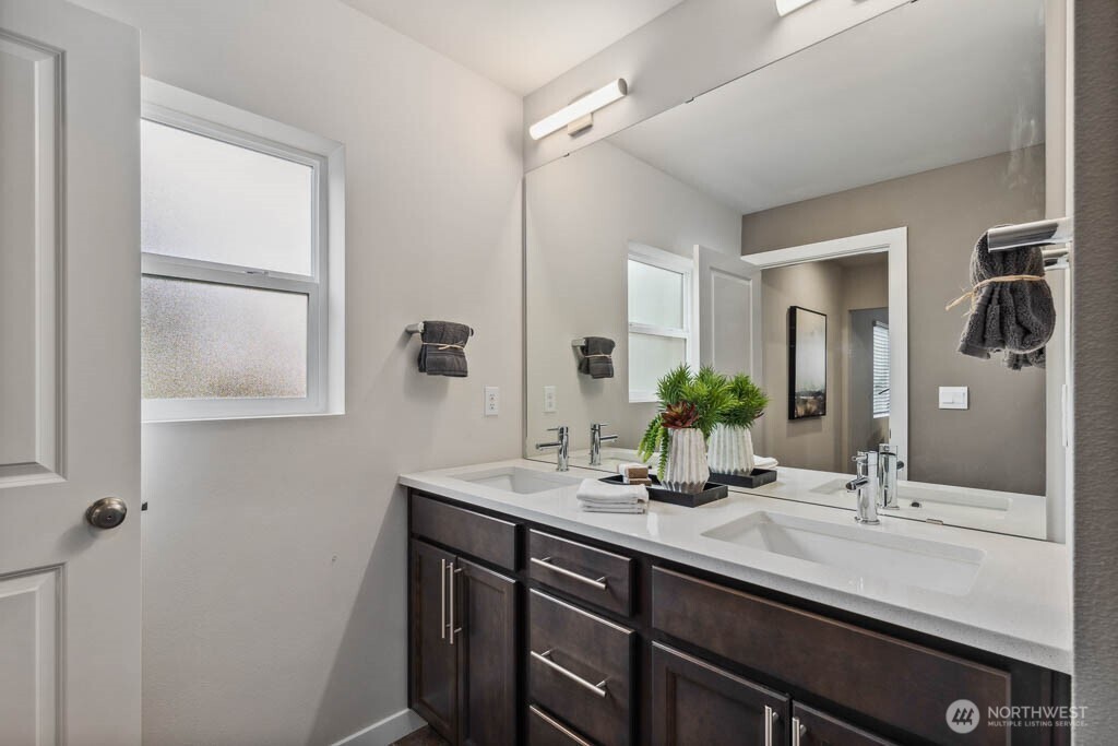 3807 194th Place Southeast Bothell, WA 98012 - Photo 19 of 21 a bathroom with a double vanity sink and a mirror