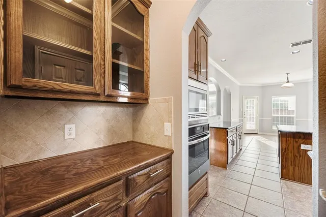 a kitchen with stainless steel appliances granite countertop a stove and a microwave