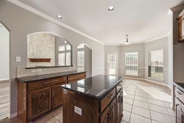 a kitchen with a stove a sink and a refrigerator