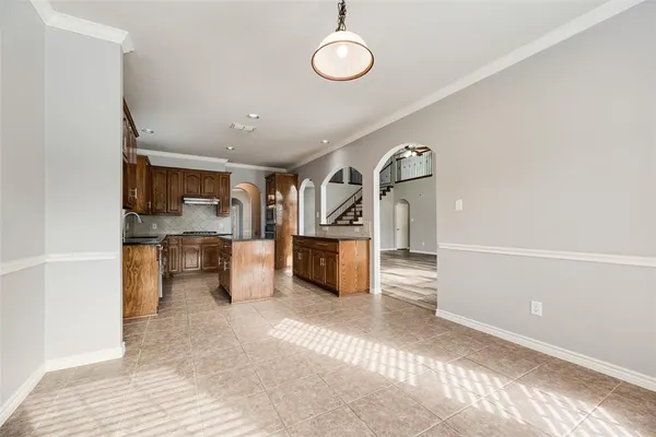 a view of a kitchen with a sink and cabinets