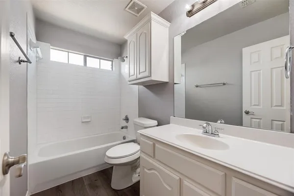 a bathroom with a sink a toilet and a bathtub