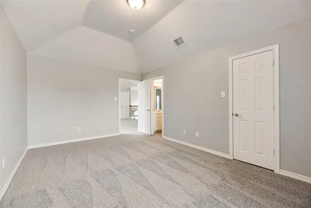wooden floor in a room with a bathroom