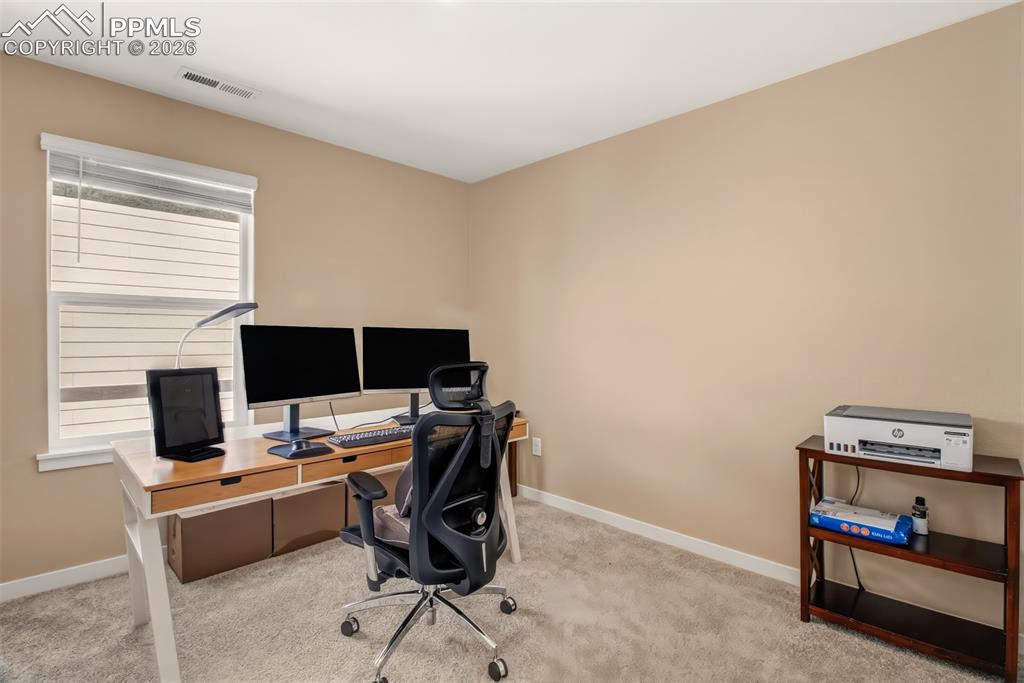 6133 Alpine Ridge Drive Colorado Springs, CO 80925 - Photo 18 of 31 a view of a workspace with furniture