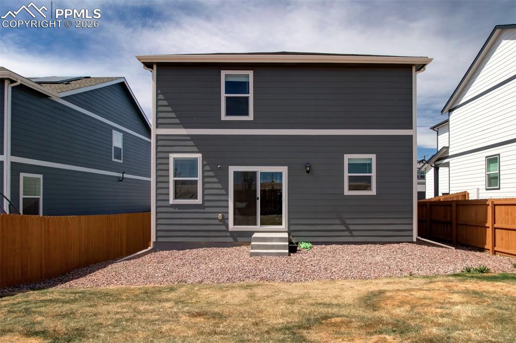 6133 Alpine Ridge Drive Colorado Springs, CO 80925 - Photo 23 of 31 a front view of a house