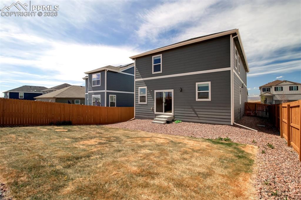 6133 Alpine Ridge Drive Colorado Springs, CO 80925 - Photo 24 of 31 a backyard of a house