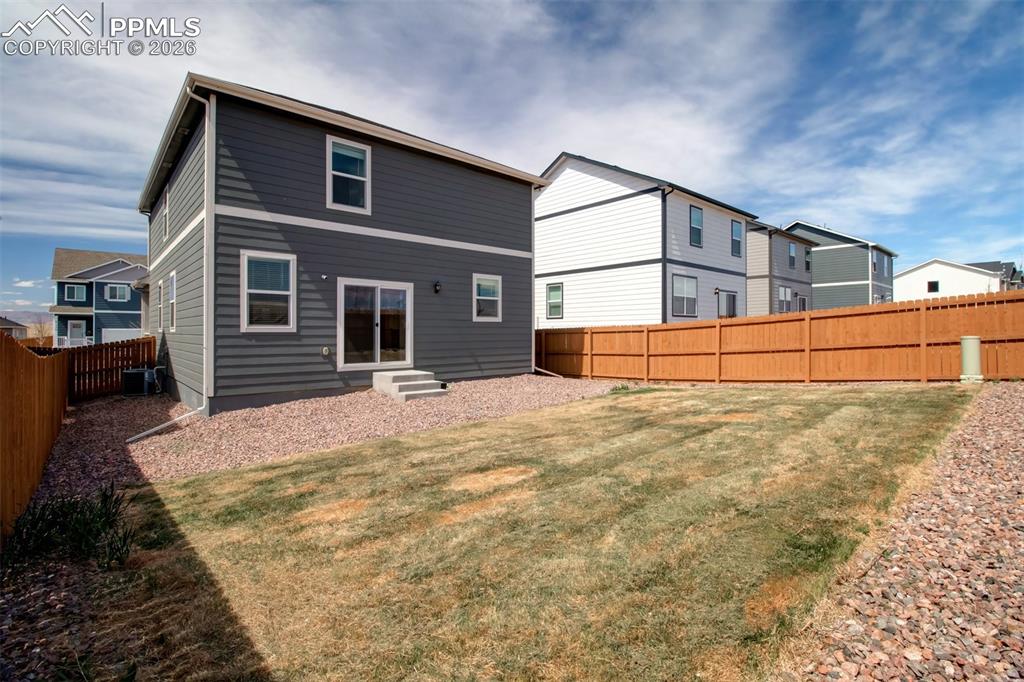 6133 Alpine Ridge Drive Colorado Springs, CO 80925 - Photo 25 of 31 a backyard of a house