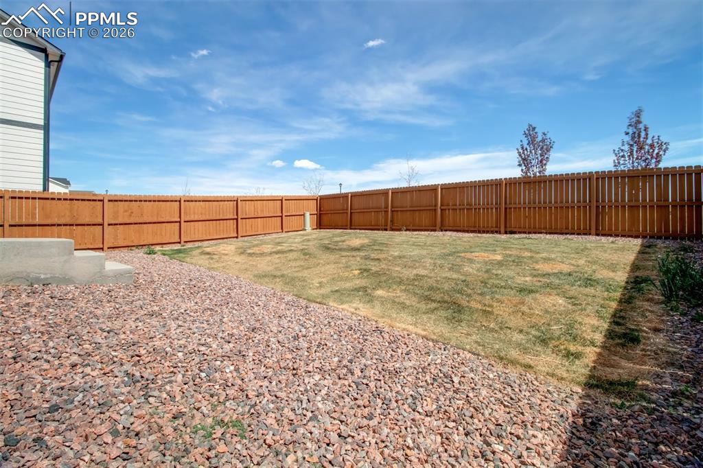 6133 Alpine Ridge Drive Colorado Springs, CO 80925 - Photo 28 of 31 a view of a backyard