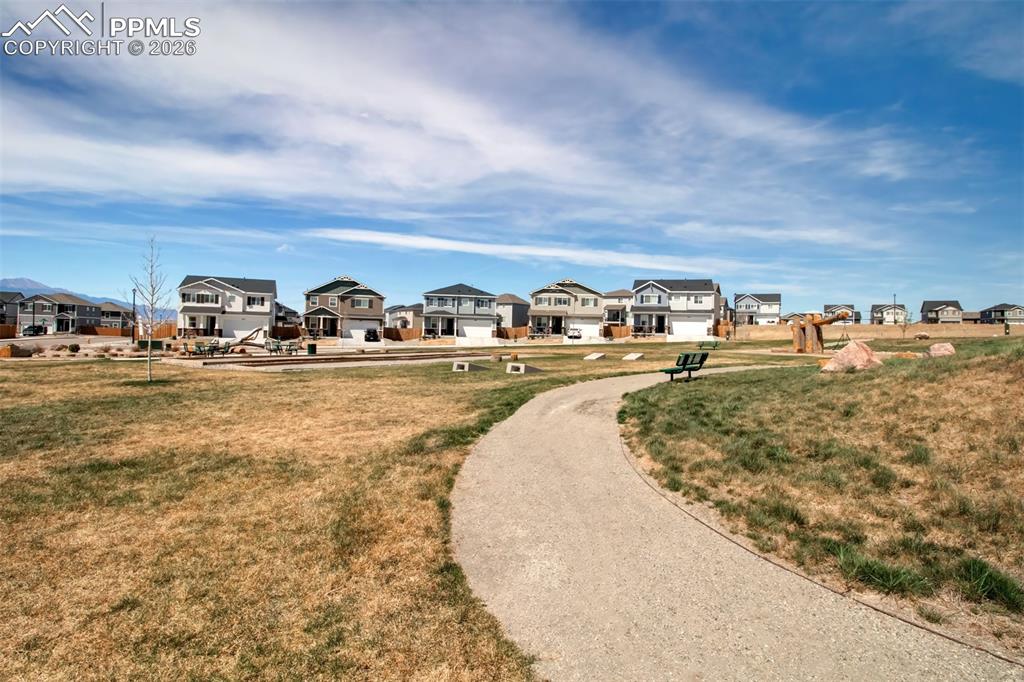 6133 Alpine Ridge Drive Colorado Springs, CO 80925 - Photo 30 of 31 a view of a swimming pool with an ocean view