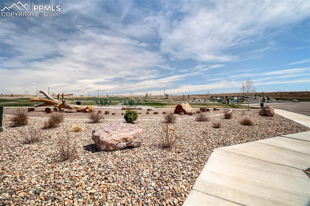 6133 Alpine Ridge Drive Colorado Springs, CO 80925 - Photo 31 of 31 a view of a lake with beach