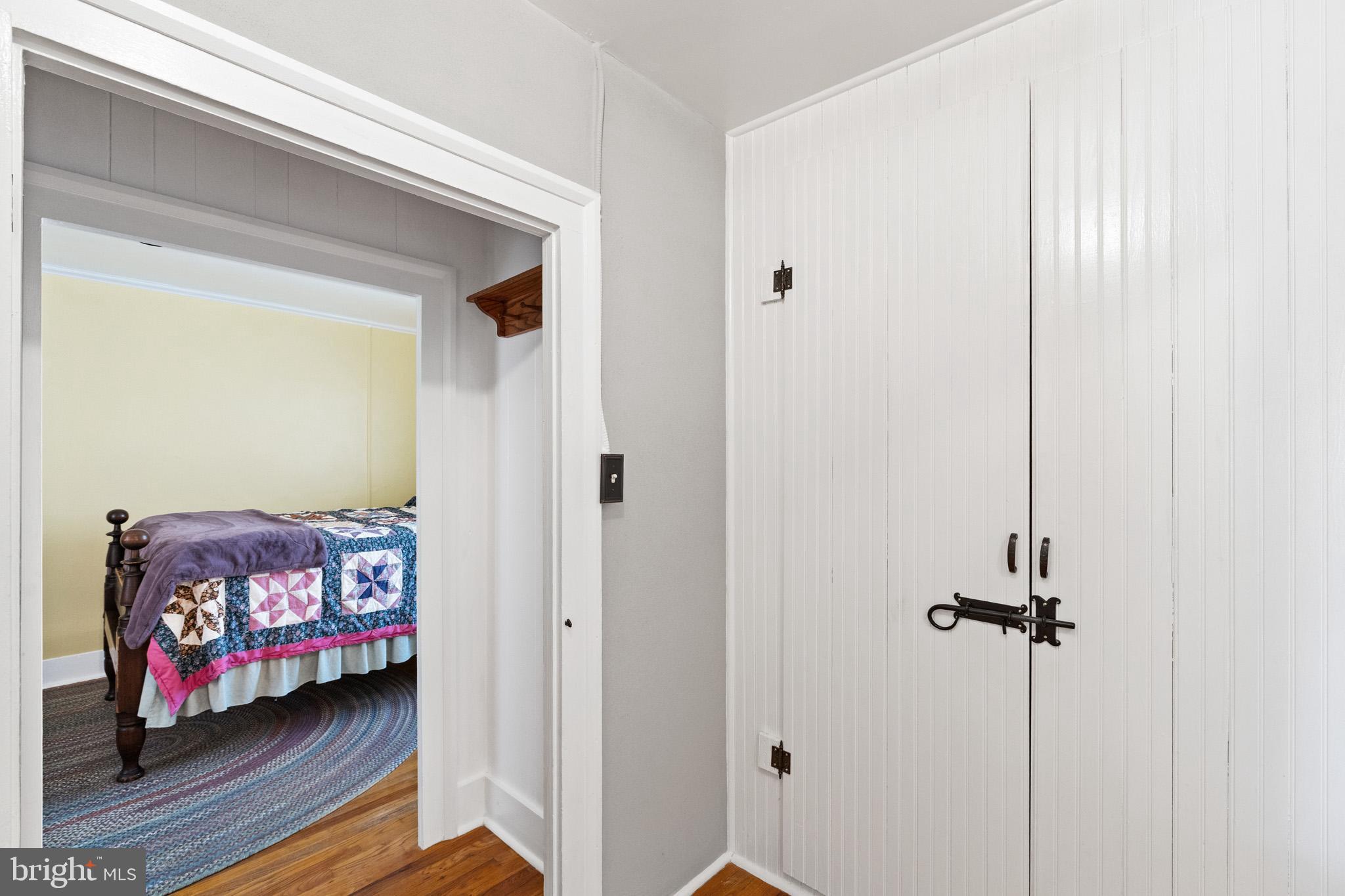 989 Swover Creek Road Edinburg, VA 22824 - Photo 63 of 132 a view of a bedroom with a bed and wooden floor