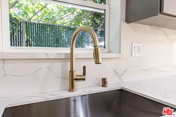 a view of a sink and a window