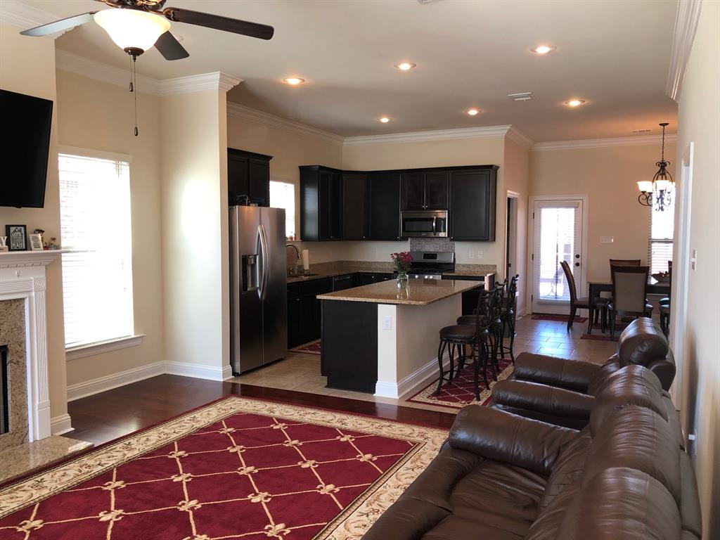 218 Apalachee Way Bossier City, LA 71111 - Photo 2 of 7 a kitchen with stainless steel appliances granite countertop a refrigerator and a stove top oven