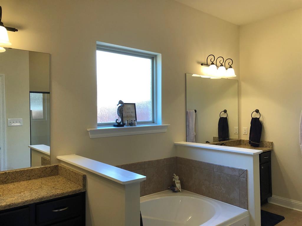 218 Apalachee Way Bossier City, LA 71111 - Photo 5 of 7 a bathroom with a toilet sink and mirror