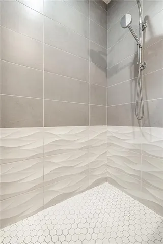 a bathroom with double sink and a mirror