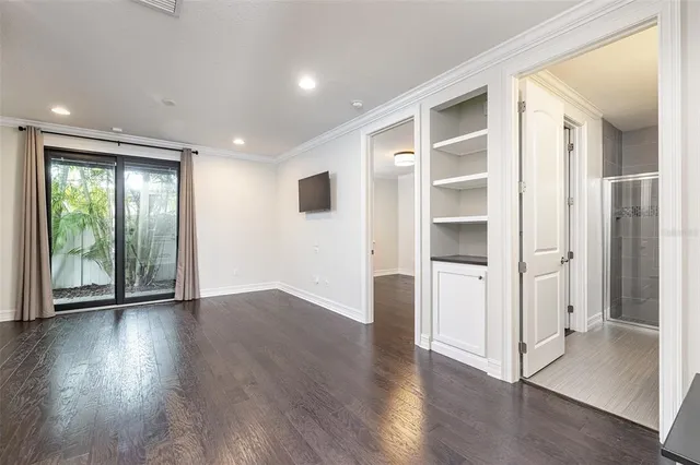 a bathroom with a granite countertop sink a toilet and shower