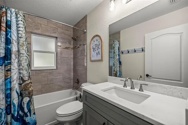 a bathroom with a toilet a sink and a bathtub