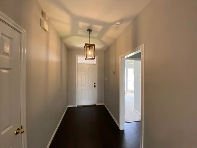 a view of hallway with windows
